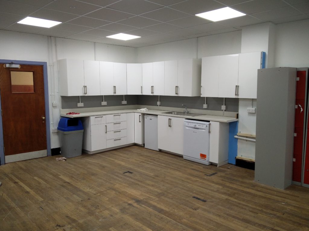 Looking at the kitchen cabinets are area