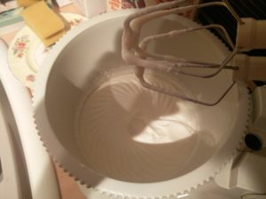 The sugar and cream mixture showing slight signs of whipping