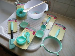 A selection of baking utensils on a draining board
