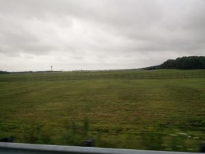The far end of Washington Dulles airport runway, with a plane and the air traffic control towers